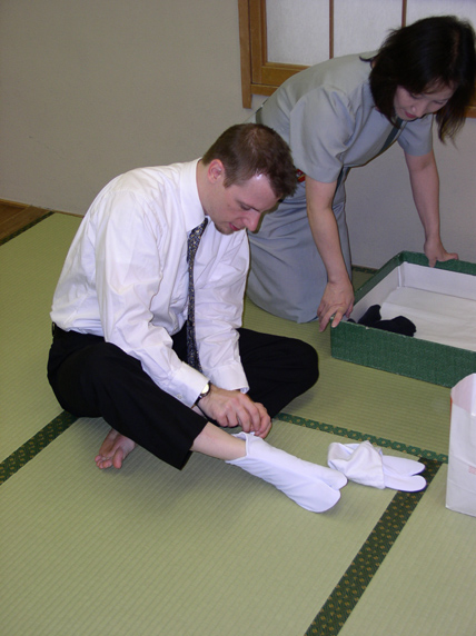 Getting dressed. Note cool white ninja booties.