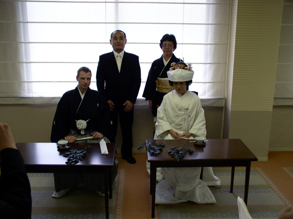 See, we're sitting and Yumi's parents are standing. All in the sitting room. It's all very organized.