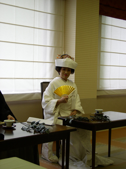 Yumi, looking resplendent with golden fan...