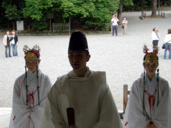 That's the Shinto prirest who performed the ceremony and his two helpers...