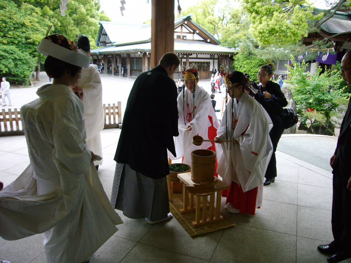The wedding ceremony starts with us cleaning our hands...